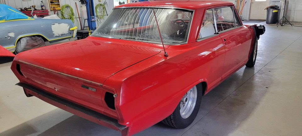 Redline — a 1965 Chevy II Nova mid-build in the restoration bay