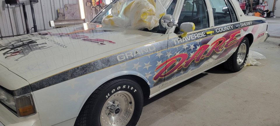 The Grand Traverse County Sheriff D.A.R.E. car in the shop for refinishing
