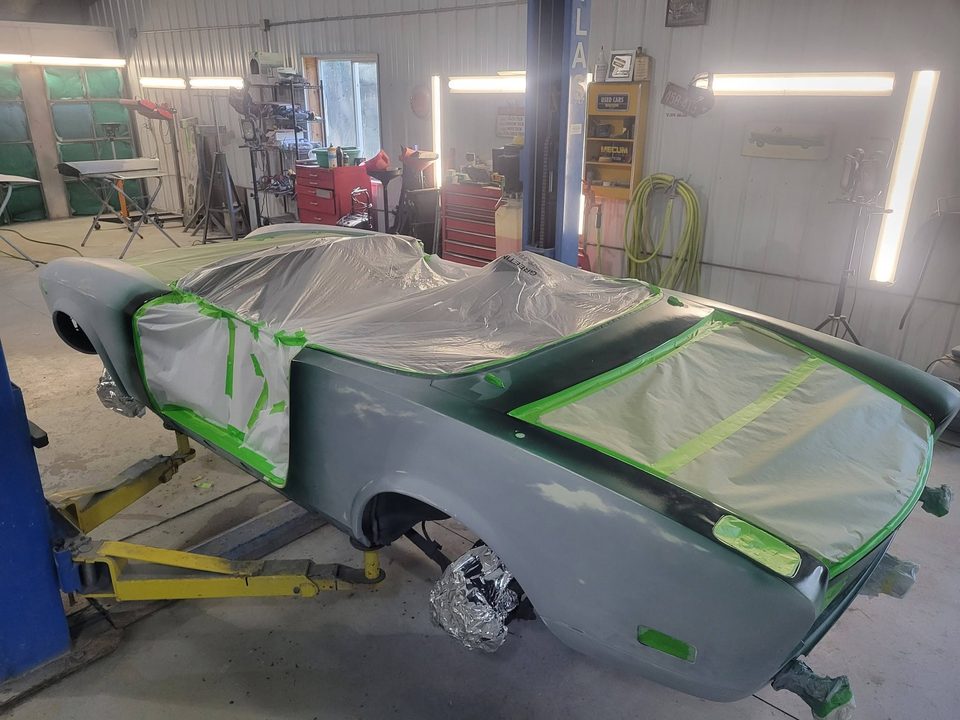 Green Beans — the Fiat 124 Spider in fresh deep green on the lift