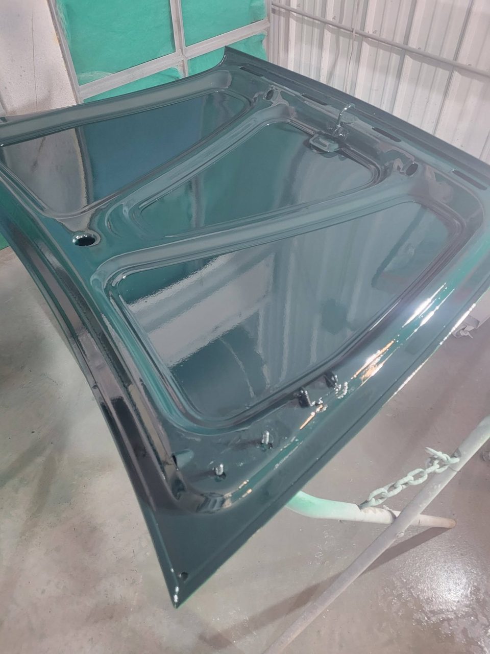 The trunk lid in its fresh deep green