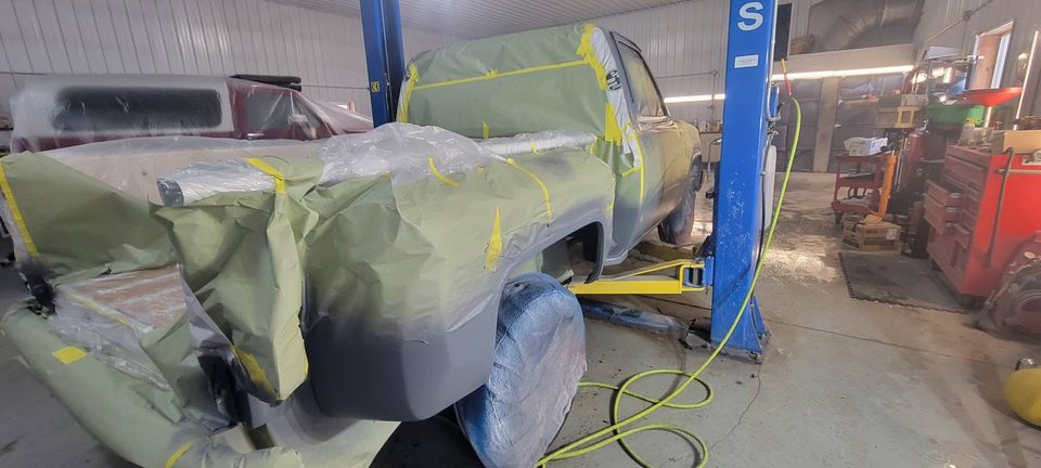 Stage 5 — bodywork done, masked and in primer on the lift