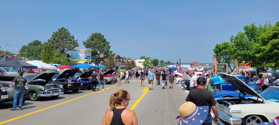 A Northern Michigan car show field on a summer afternoon