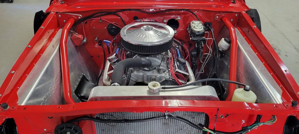 Resto-mod power — a built V8 sitting in the engine bay of a 1965 Chevy II Nova
