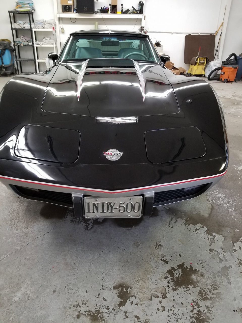 The finished car in the shop, INDY-500 plate on the nose