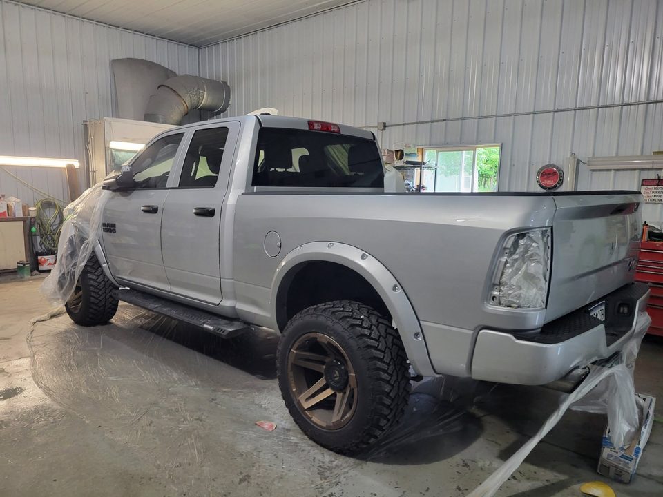 A Ram 2500 masked up in the shop during a custom build